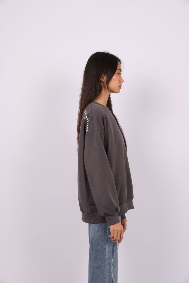 NEVER LOOK BACK OVERSIZED SWEATSHIRT